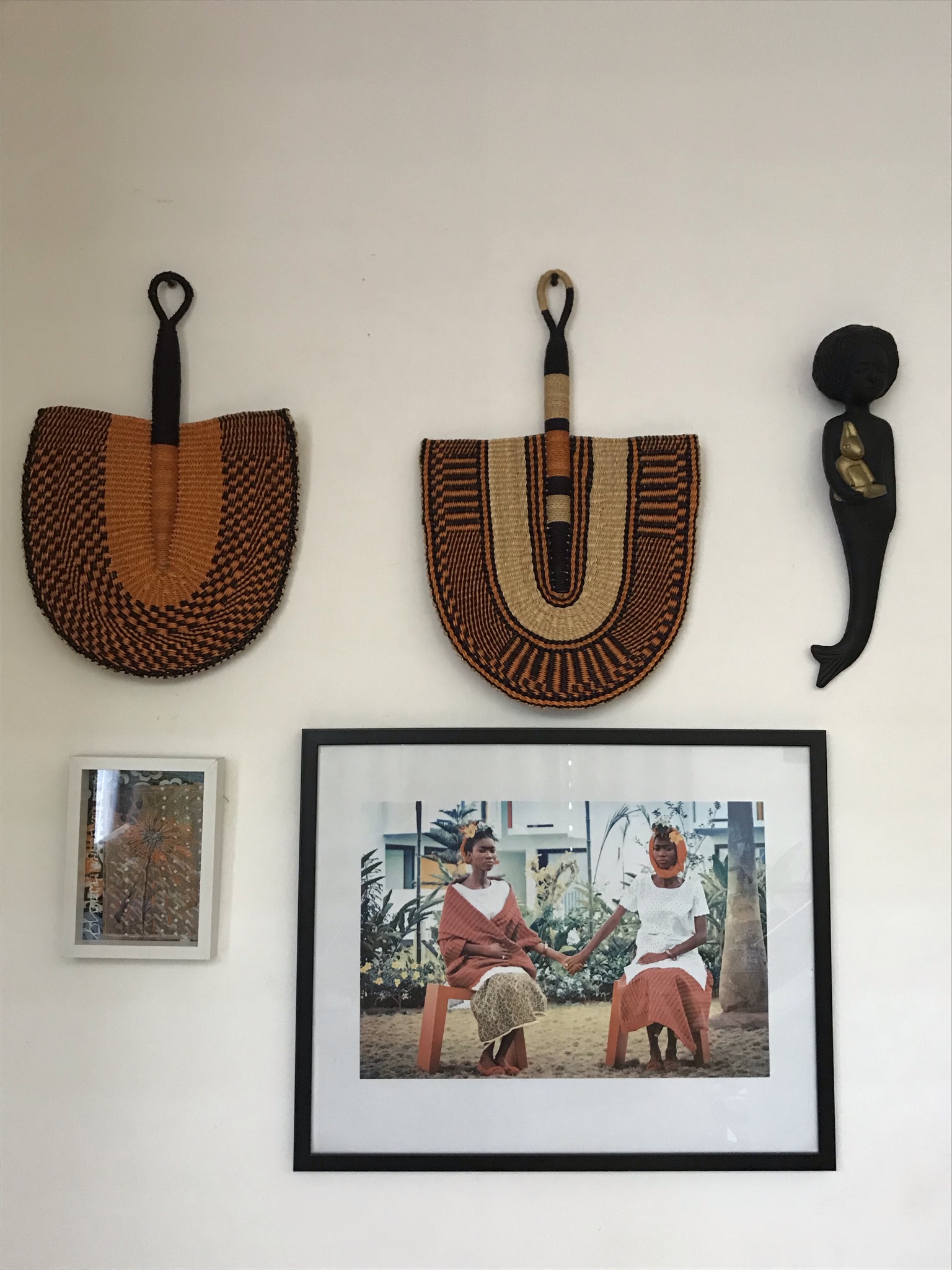 Zodwa the mermaid by Noush Projects Manoushka Kraal hanging on a wall with Bolgatanga fans